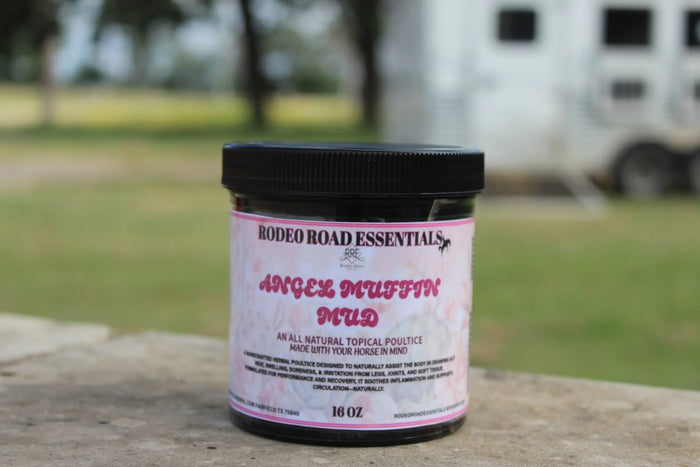 16 oz jar of Angel Muffin Mud positioned on outdoor surface, promoting quick relief for sore muscles and joints.